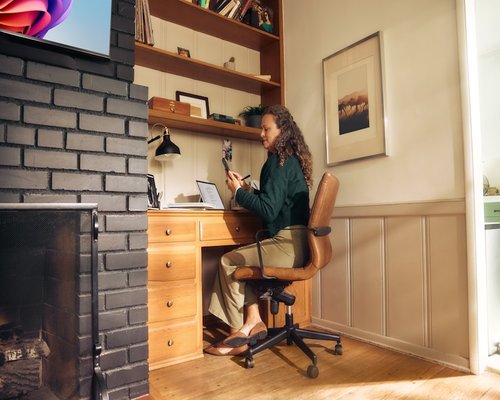 A person working from a cozy home office setting