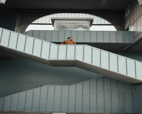 Person taking the stairs instead of an elevator in a building